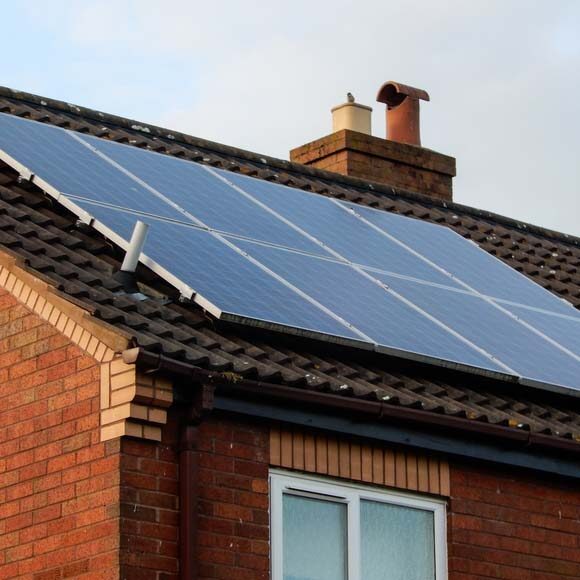 Roof mounted solar panels. Solar panels mounted on a house roof in Reading.
